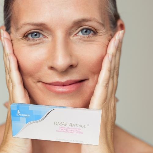 Happy mature woman touching her face and box of DMAE Antiage Serum